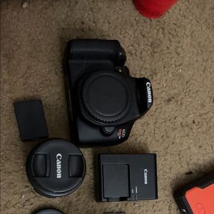 Canon camera with multiple licenses, batteries adapters.